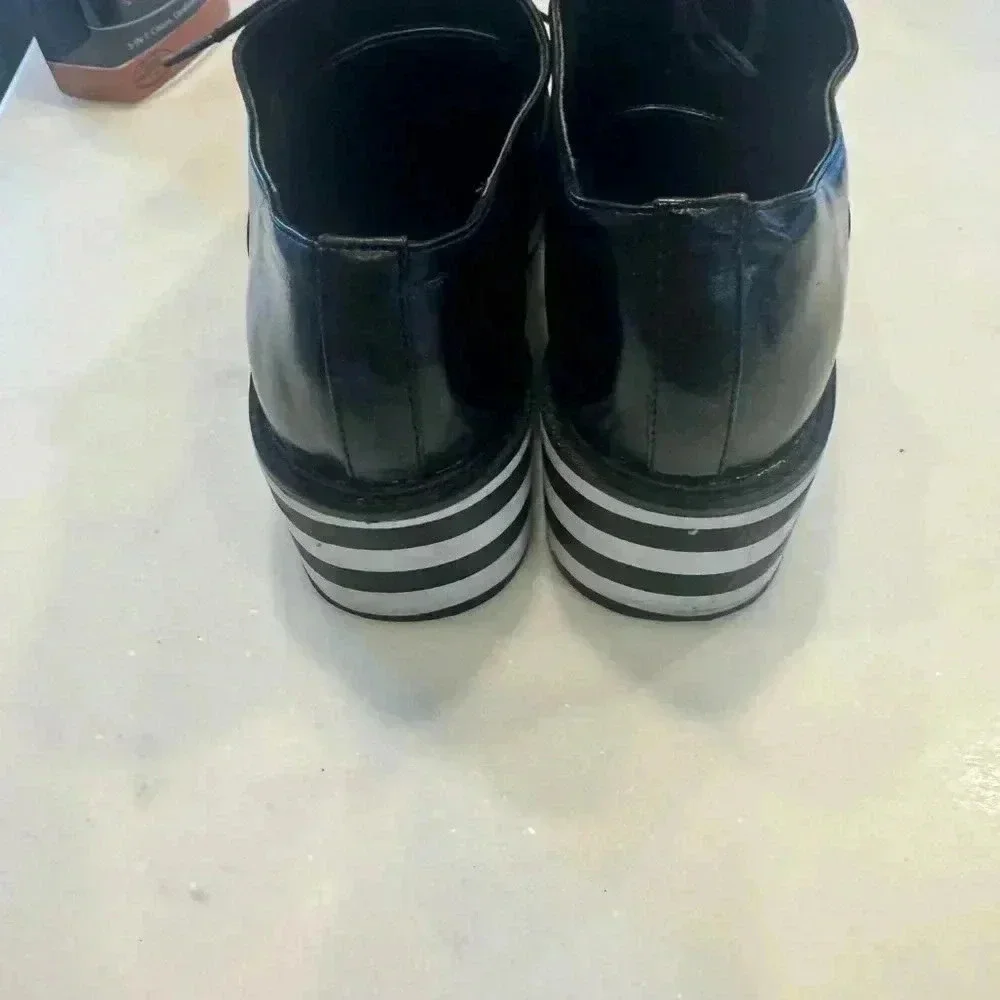 Aldo women’s platform leather wingtips / black & white sole size 9